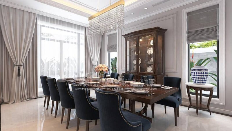 Trang trí nội thất phòng ăn gỗ óc chó tân cổ điển đẹp, sang trọng từ bàn gỗ nguyên khối, ghế bọc nệm cao cấp, kệ, tủ kệ trang trí. Thiết kế nội thất