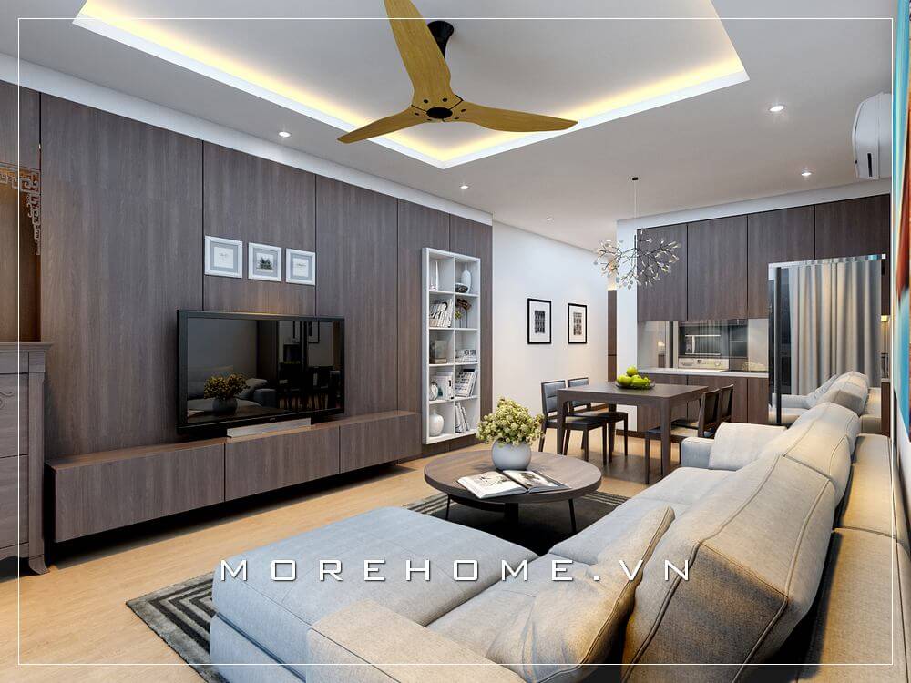 Thiết kế nội thất phòng khách liền bếp ăn hiện đại ấn tượng với vẻ đẹp gỗ óc chó ốp tường cho căn hộ chung cư.